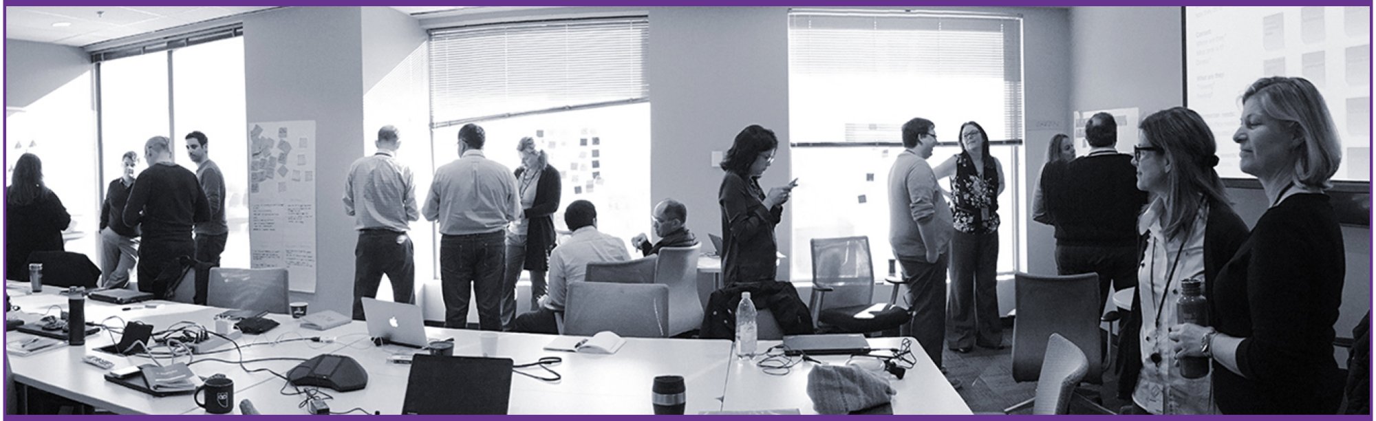 Groups of BC Hydro employees in a boardroom participating in a co-creation workshop