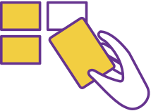 A hand holding a card that has been picked up from a flat surface