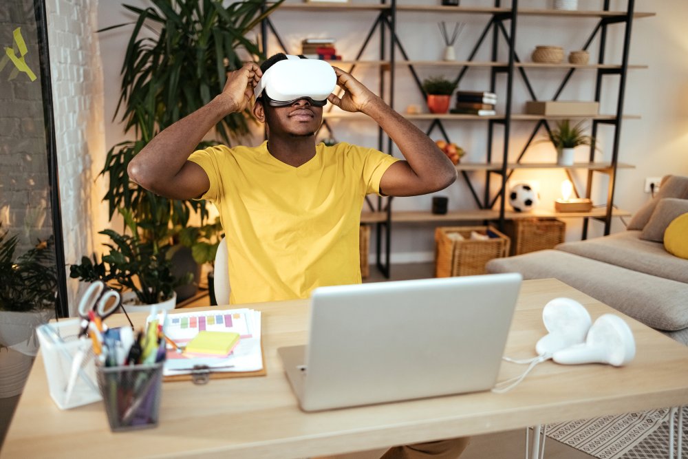 Man sitting at desk with a Meta on Quest device on showing their first impression of the product